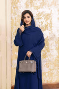 Full-length front view of Deep Blue Lace Abaya styled with a gray luxury handbag for a professional look
