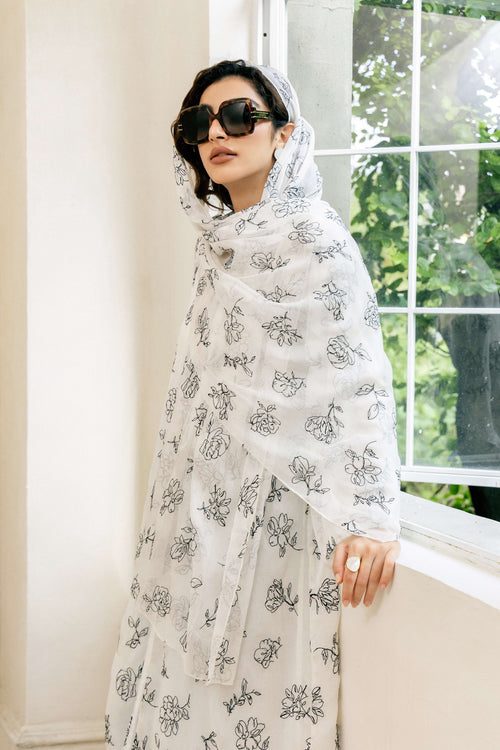 Side profile of White Abaya with high-contrast black floral patterns