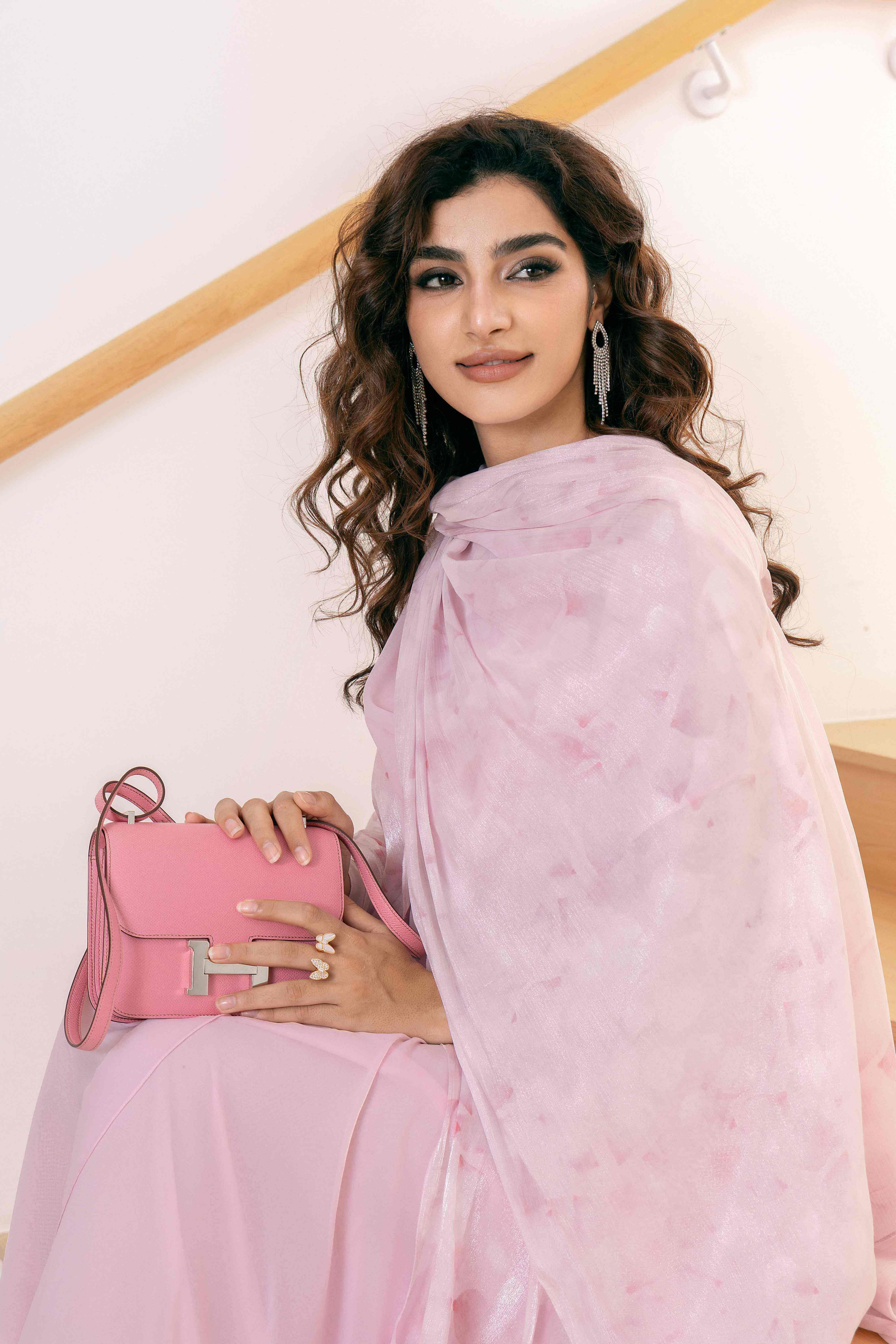 Close-up of the light pink modest dress set featuring a refined floral design