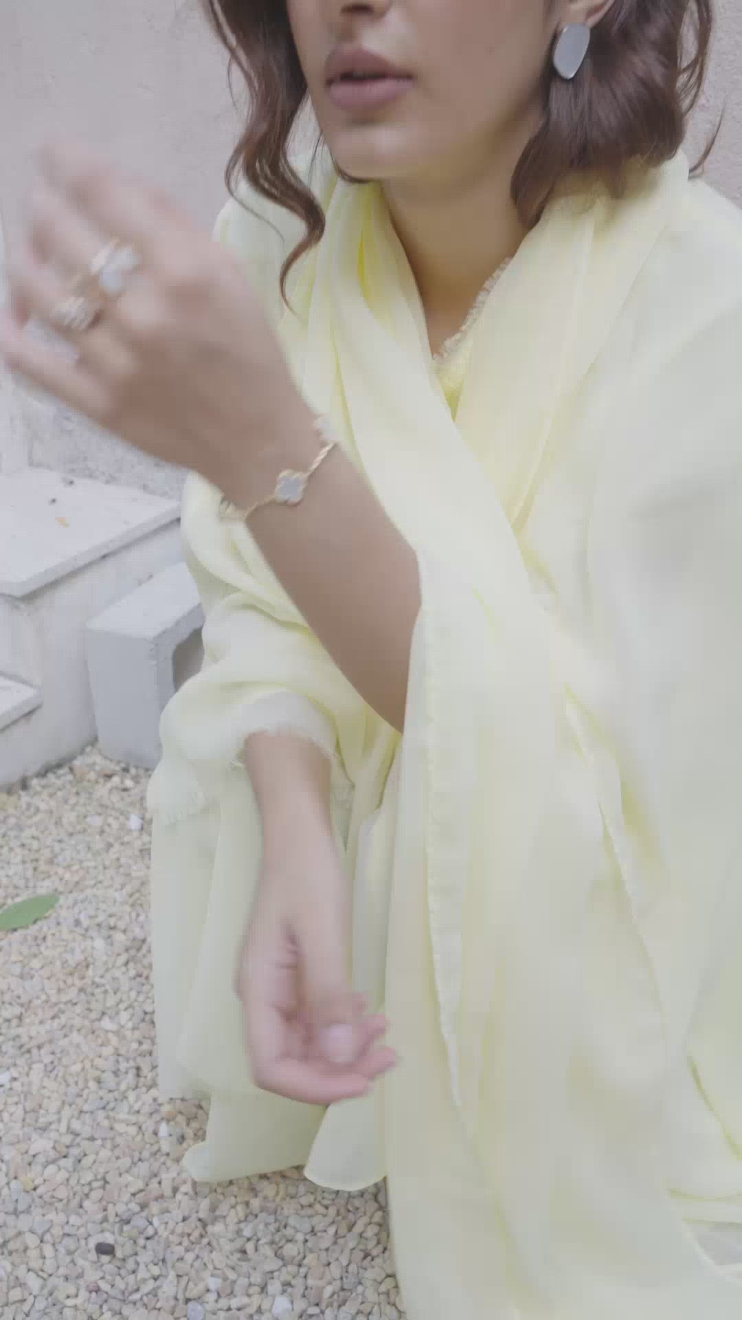 Detailed view of Light Yellow tassels on sheer Abaya sleeve