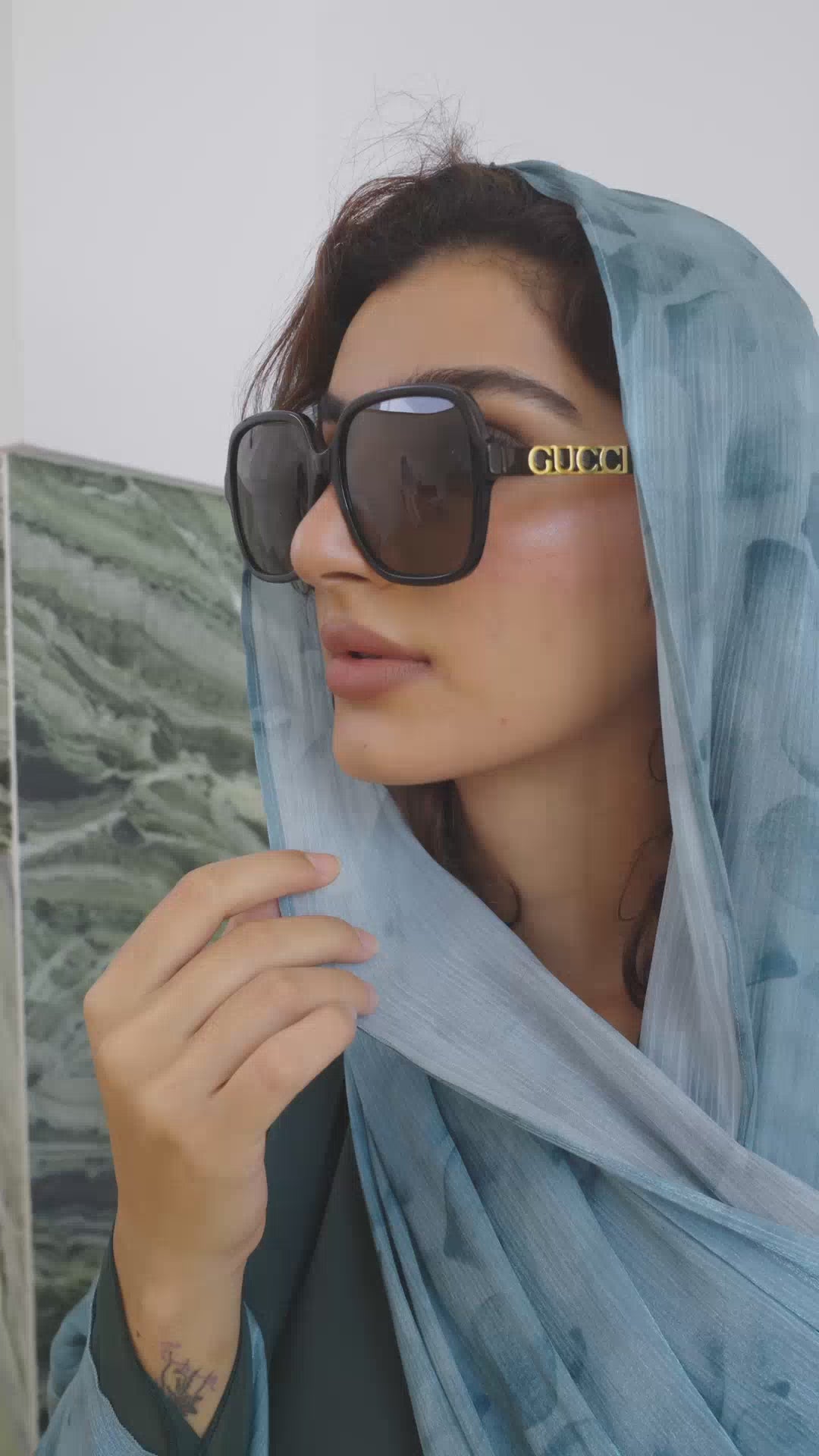 Up-close look at the artistic floral design of the Garden Green Abaya